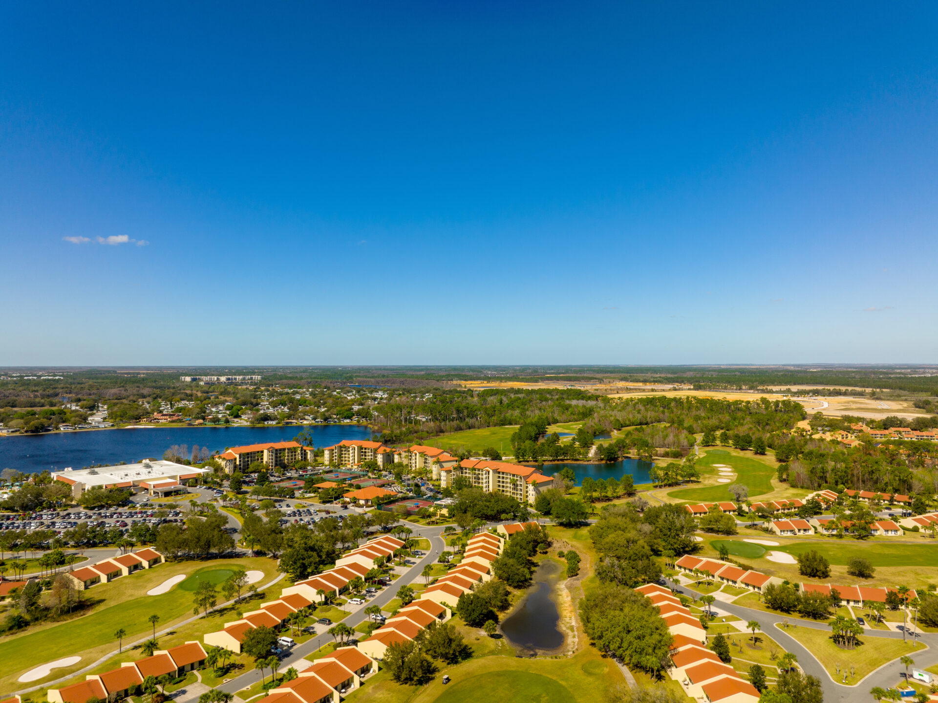 Kissimmee, FL, USA - February 20, 2022: Aerial photo of Orange lake resort Sun shining over beautiful Lake Eola park in Orlando